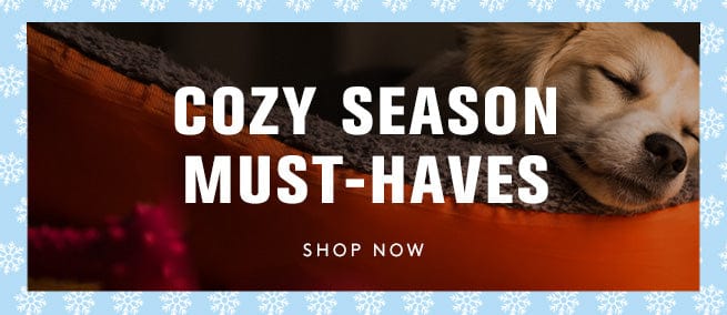 Sleeping dog on a blanket with 'Cozy Season Must-Haves' text and 'Shop Now' button.